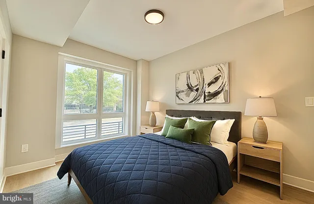 a bedroom with a bed and window