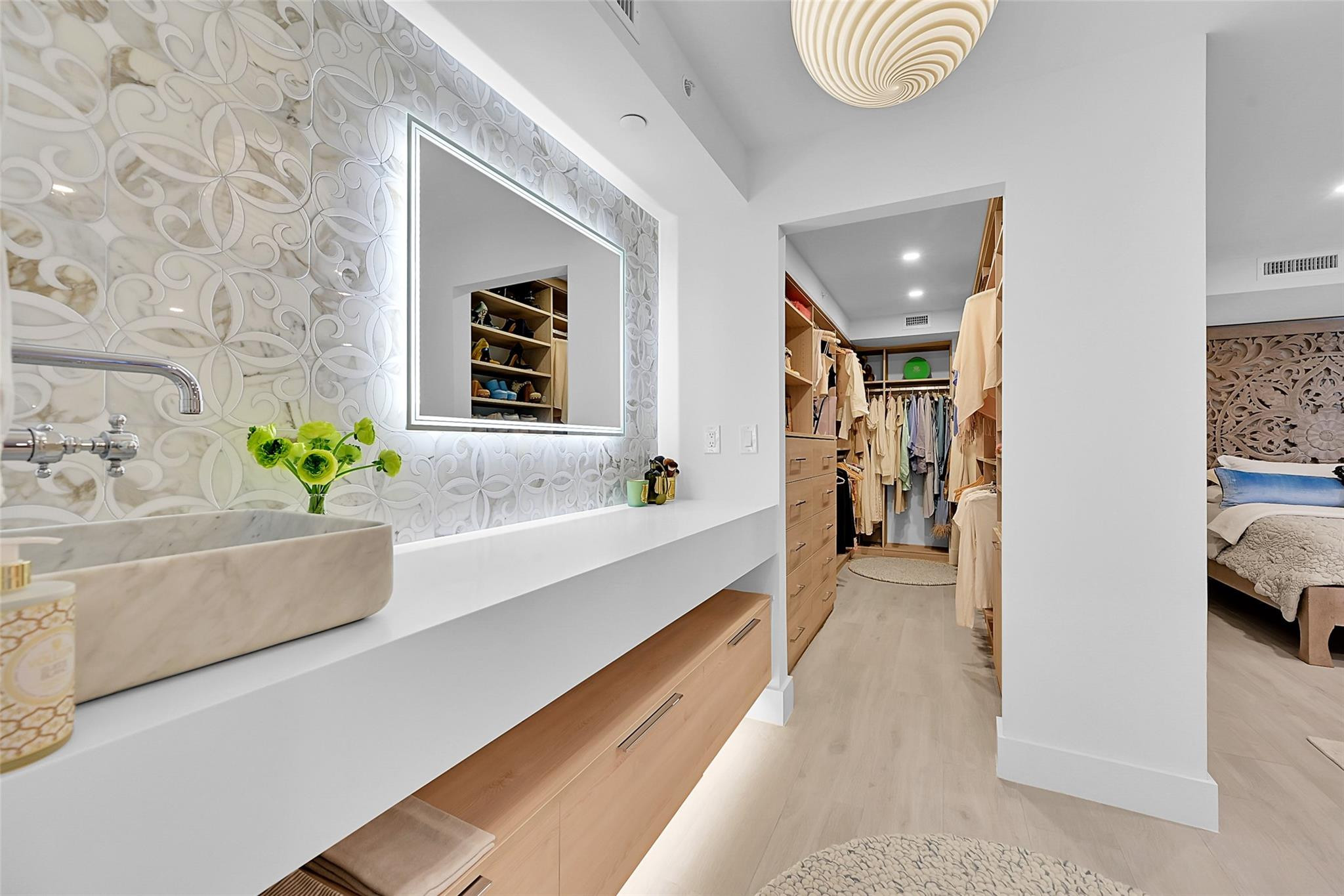 100 Southeast 5th Avenue, Unit 106 Boca Raton, FL 33432 - Photo 18 of 42 Vanity and Walk-In Closet