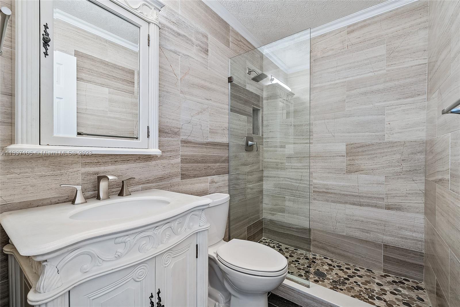 169 Greentree Circle Jupiter, FL 33458 - Photo 11 of 38 a bathroom with a sink toilet and shower