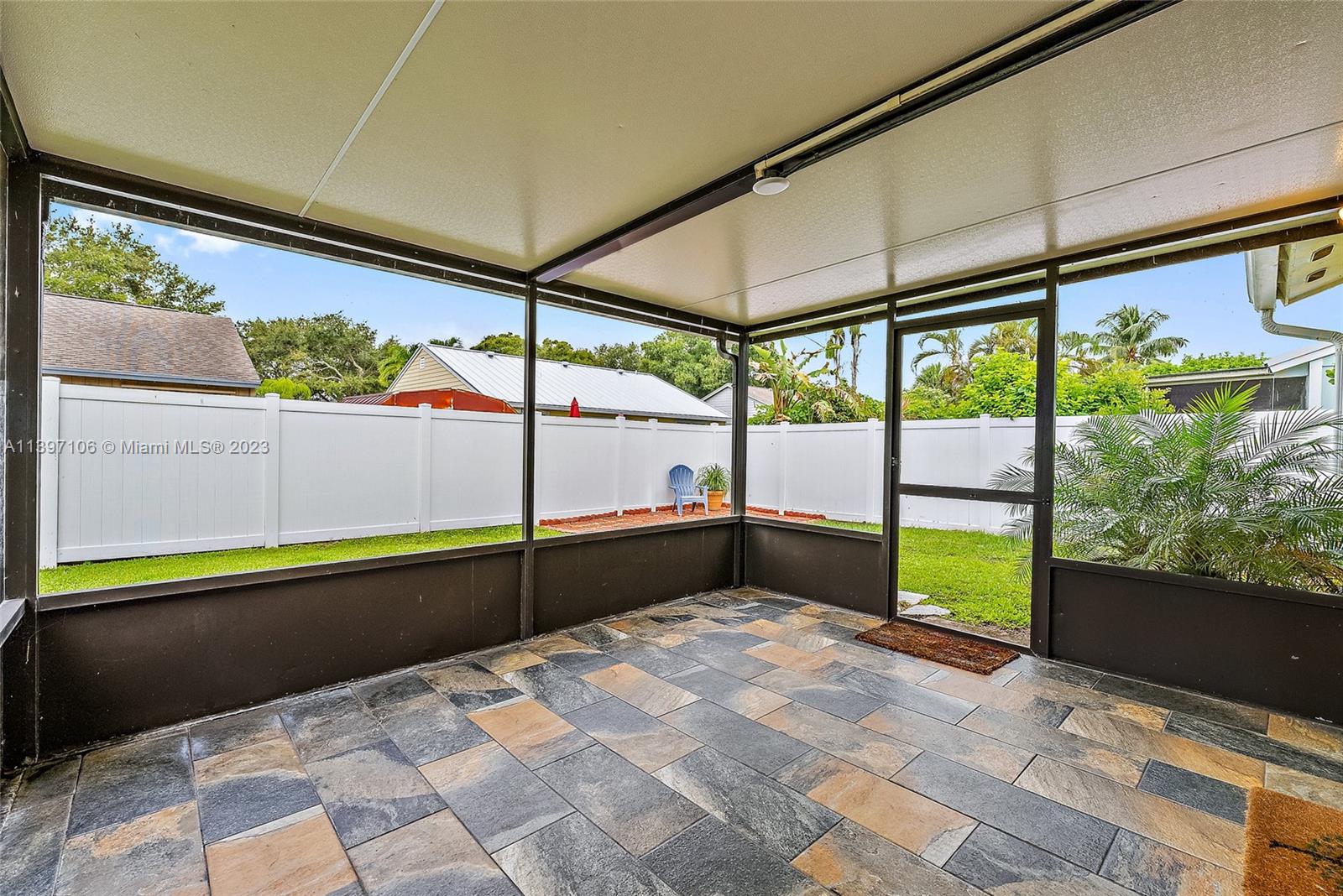 169 Greentree Circle Jupiter, FL 33458 - Photo 16 of 38 a bedroom with a bed and large window