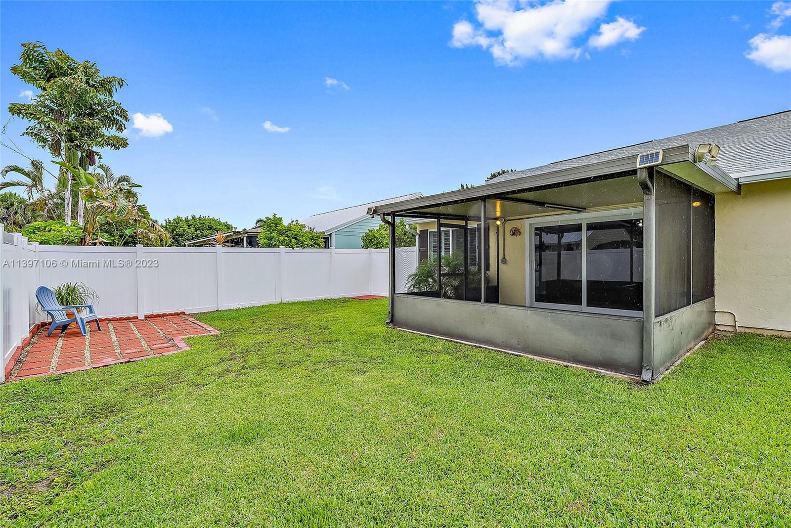 169 Greentree Circle Jupiter, FL 33458 - Photo 18 of 38 a view of backyard with seating area and green space