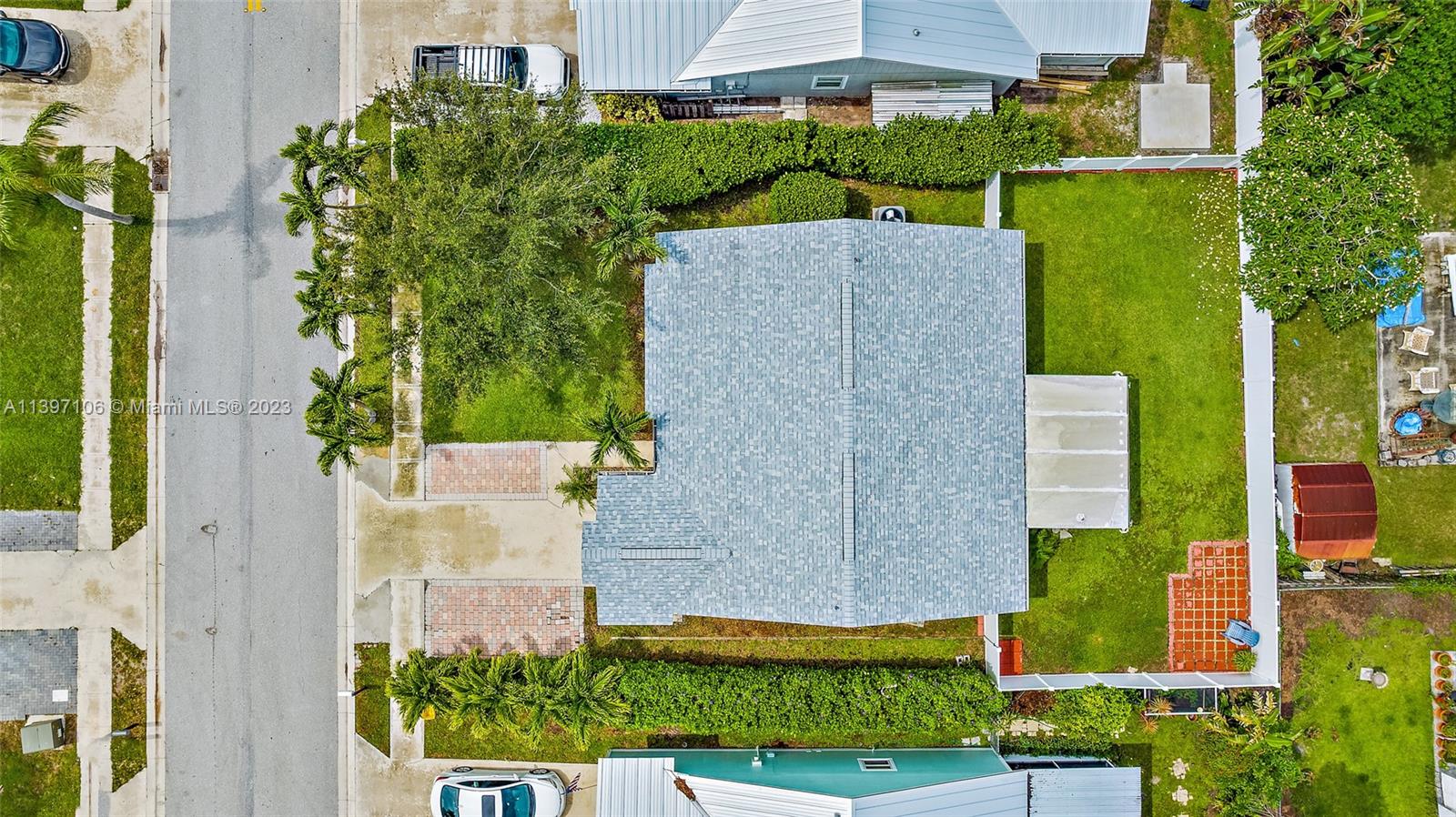 169 Greentree Circle Jupiter, FL 33458 - Photo 20 of 38 front view of a house with a yard