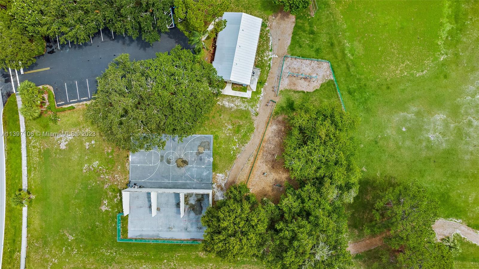 169 Greentree Circle Jupiter, FL 33458 - Photo 23 of 38 an aerial view of a house with a yard lake and trees all around