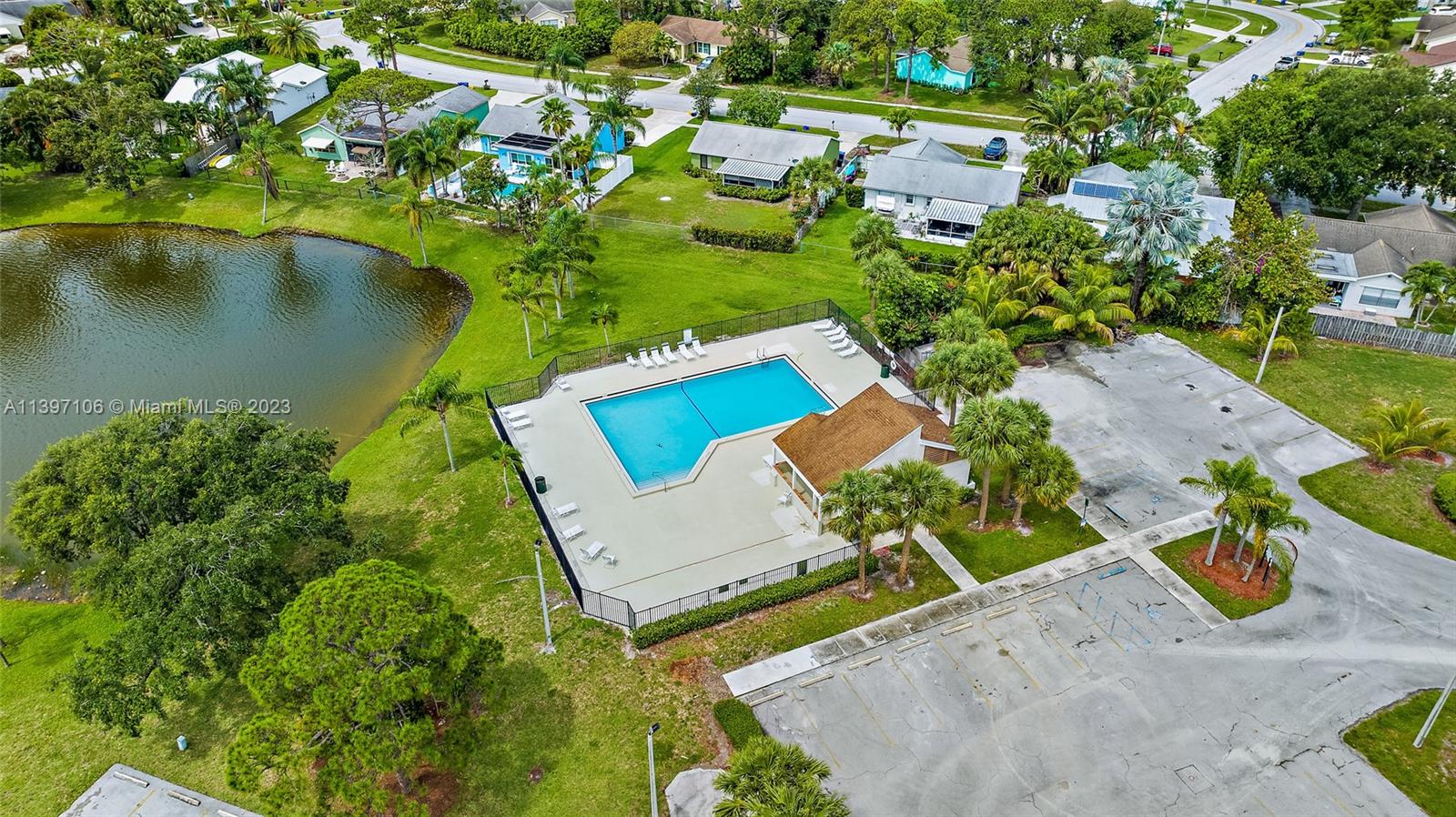169 Greentree Circle Jupiter, FL 33458 - Photo 24 of 38 an aerial view of a house with a yard and lake view
