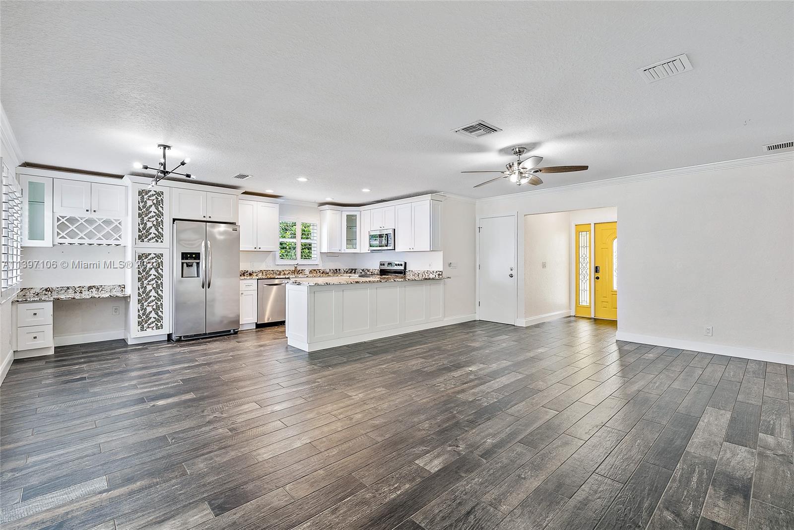 169 Greentree Circle Jupiter, FL 33458 - Photo 5 of 38 a view of a kitchen with a sink cabinets and wooden floor