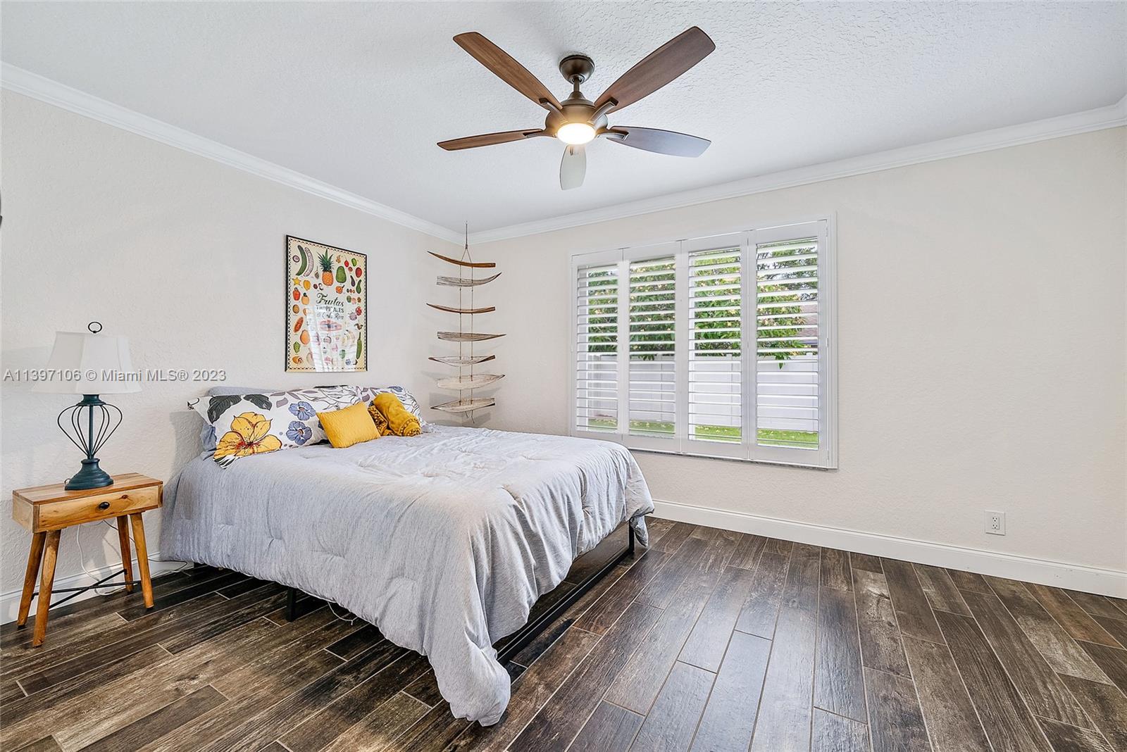 169 Greentree Circle Jupiter, FL 33458 - Photo 9 of 38 a bedroom with a bed and a window