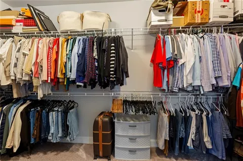 a bathroom with a tub shower and sink