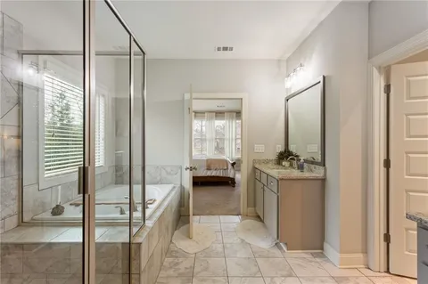 a bedroom with a bed and a desk