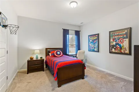 a bedroom with a bed and a tv