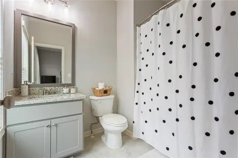 a view of a patio with couches and pool