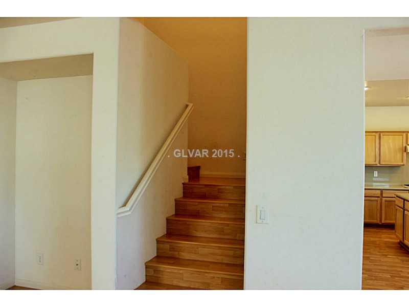 7914 Red Rock Ridge Avenue Las Vegas, NV 89179 - Photo 11 of 35 Property Photo. Laminate hardwood floors throughout.