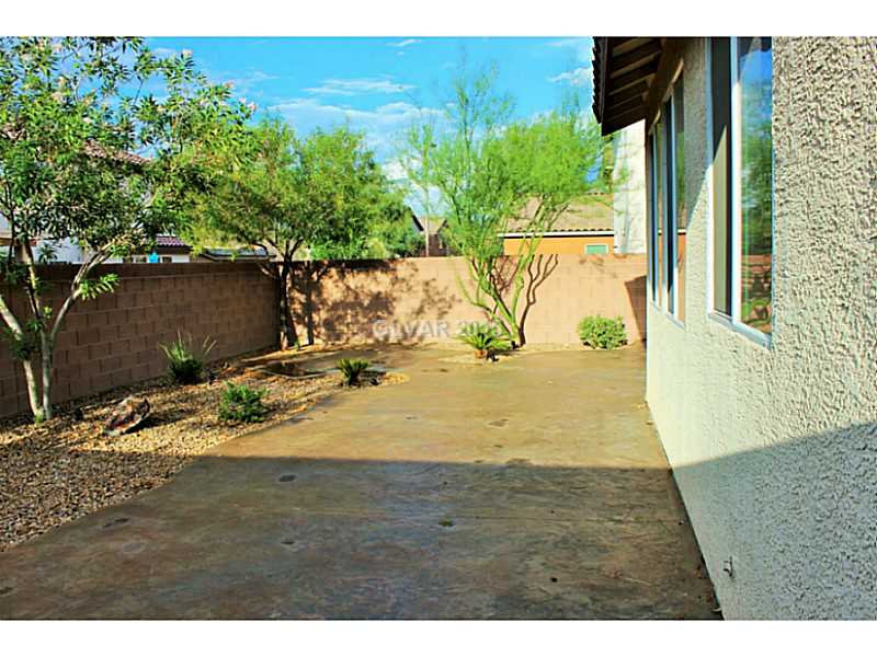 7914 Red Rock Ridge Avenue Las Vegas, NV 89179 - Photo 26 of 35 Property Photo. Backyard with stamped concrete