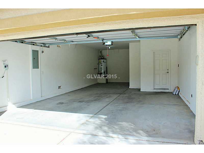 7914 Red Rock Ridge Avenue Las Vegas, NV 89179 - Photo 28 of 35 Garage. 3 Car Tandem Garage. All garage remotes will convey. Soft water loop