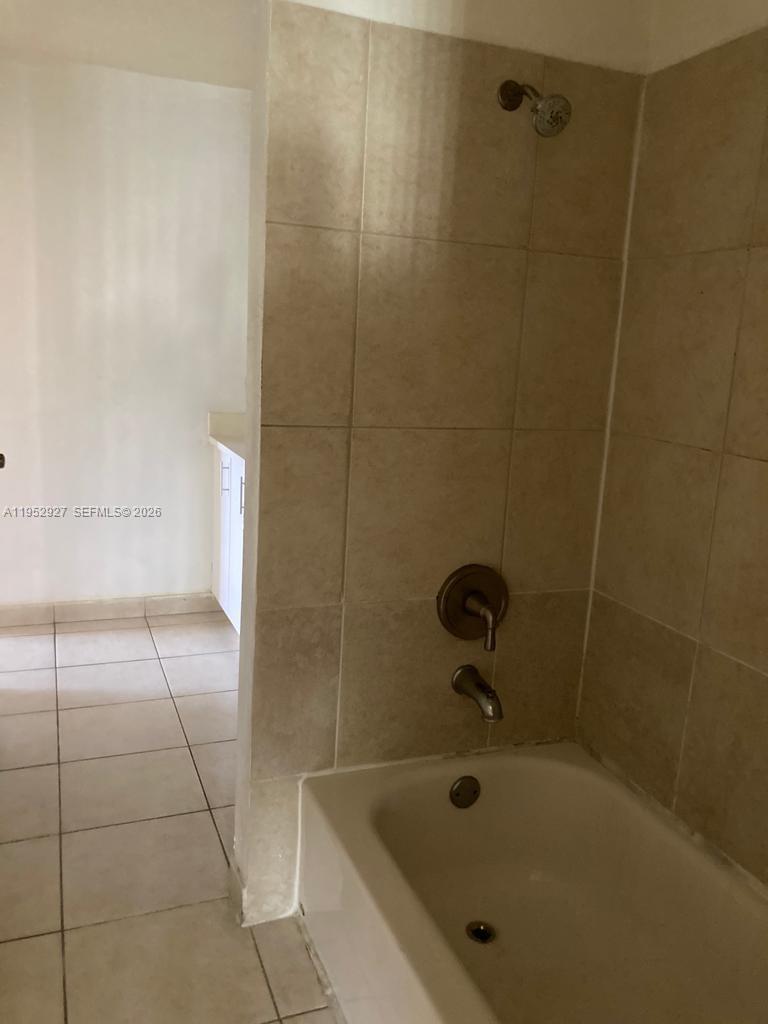 8705 Northwest 39th Street Sunrise, FL 33351 - Photo 12 of 13 a bathroom with a bathtub