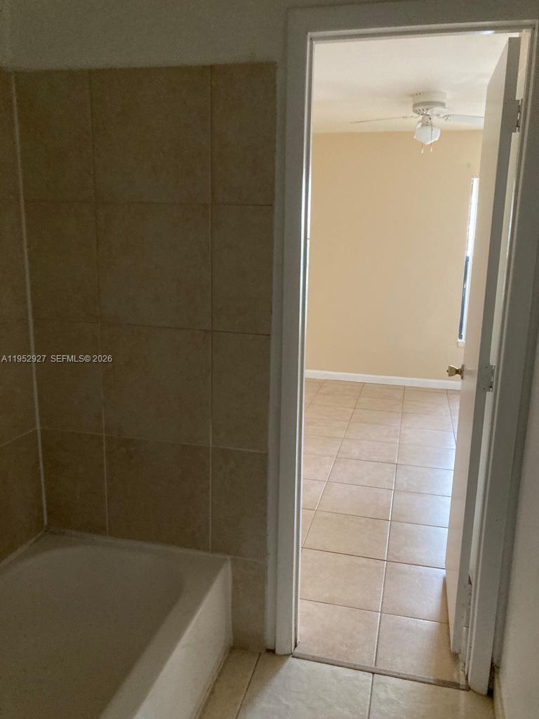 8705 Northwest 39th Street Sunrise, FL 33351 - Photo 13 of 13 a bathroom with a bathtub