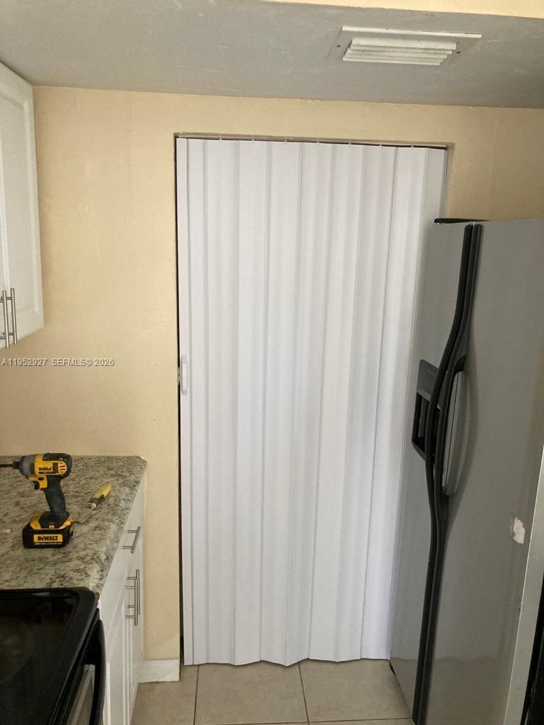 8705 Northwest 39th Street Sunrise, FL 33351 - Photo 4 of 13 a kitchen with a sink and a stove