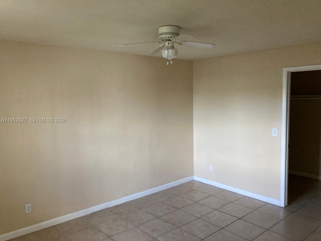 8705 Northwest 39th Street Sunrise, FL 33351 - Photo 5 of 13 an empty room with a empty space