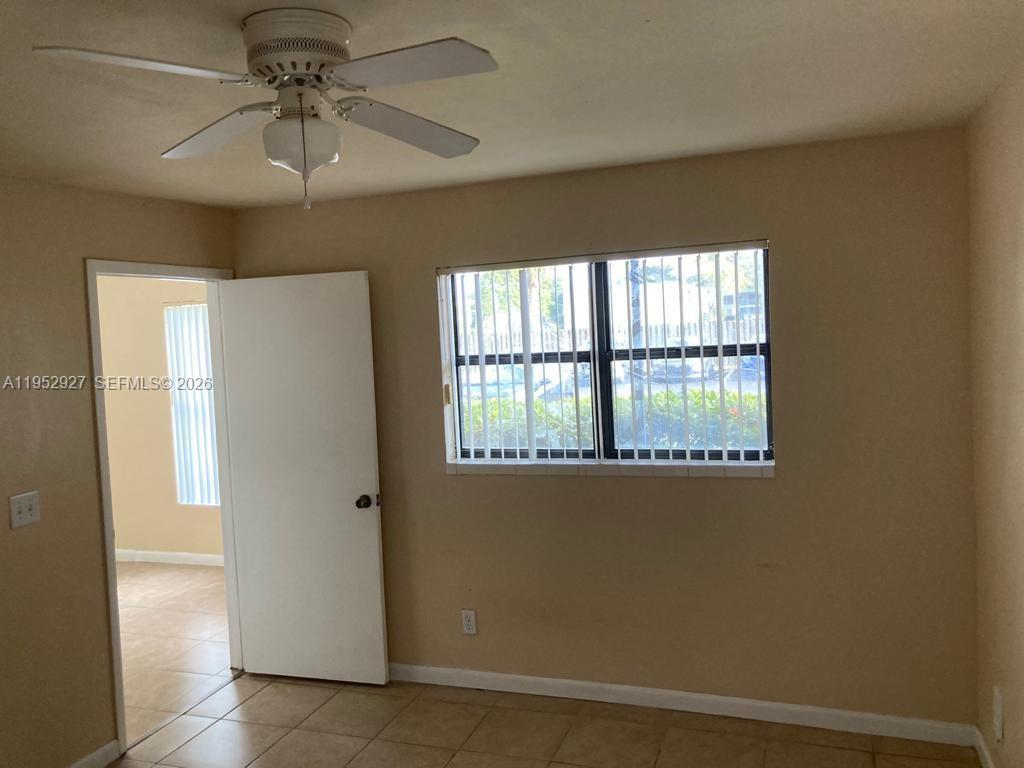 8705 Northwest 39th Street Sunrise, FL 33351 - Photo 6 of 13 a view of an empty room with a window