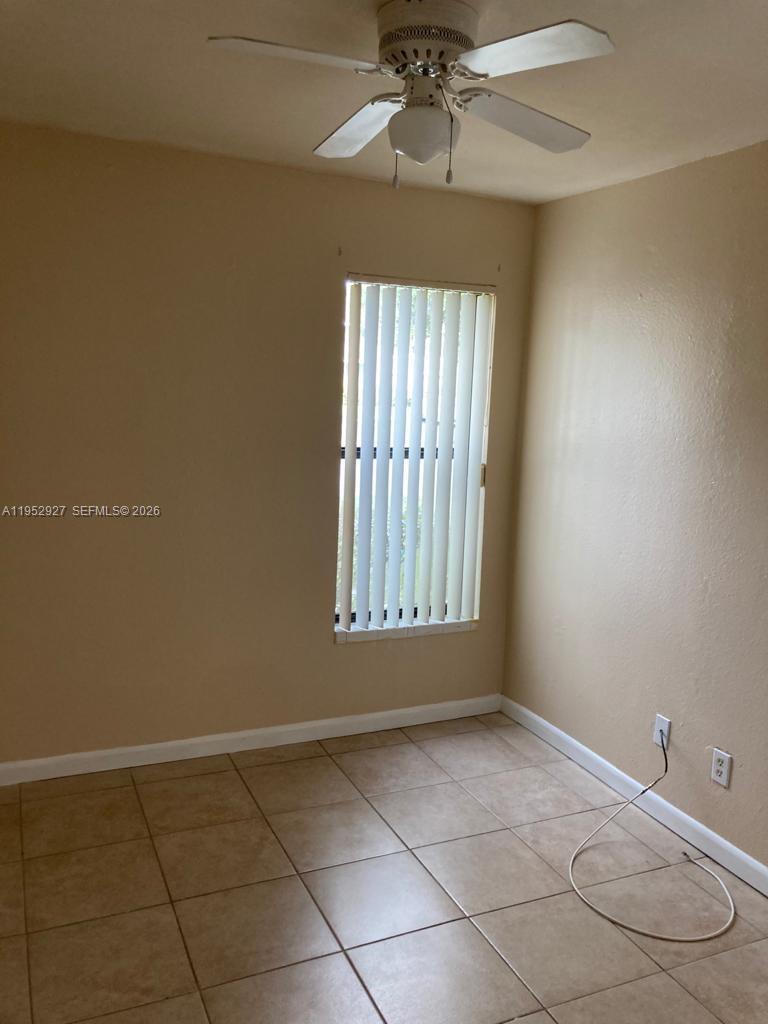 8705 Northwest 39th Street Sunrise, FL 33351 - Photo 10 of 13 a view of an empty room with a window