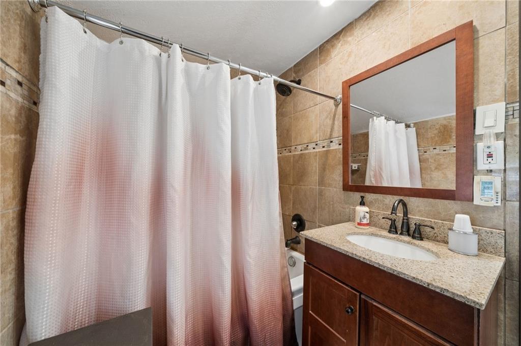 2106 Lindsay Road Pittsburgh, PA 15221 - Photo 26 of 36 The 2nd floor full bath has been recently remodeled with new tub, vanity and commode.
