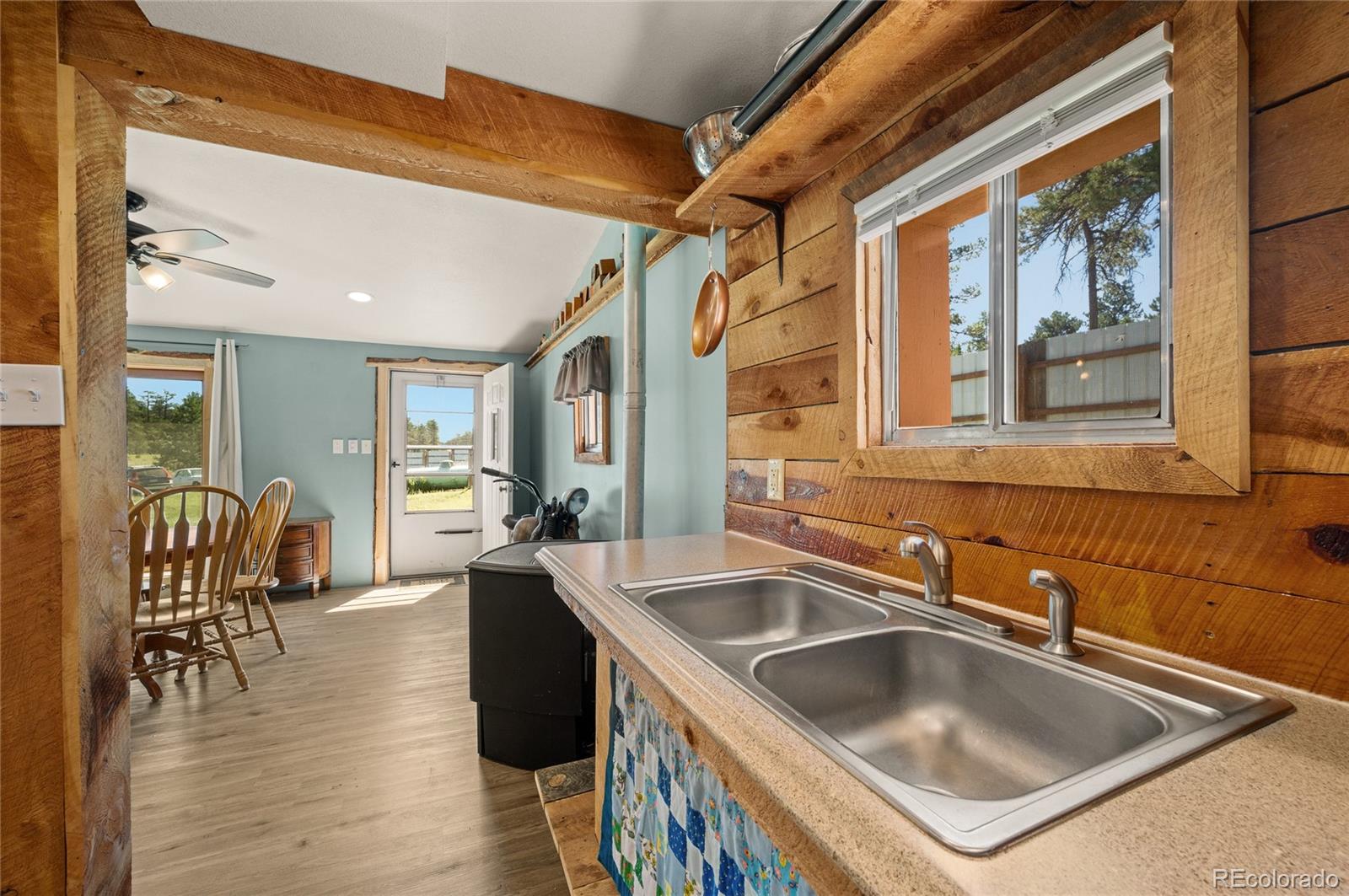 2925 M Path Cotopaxi, CO 81223 - Photo 14 of 50 a kitchen that has a sink a table and chairs in it