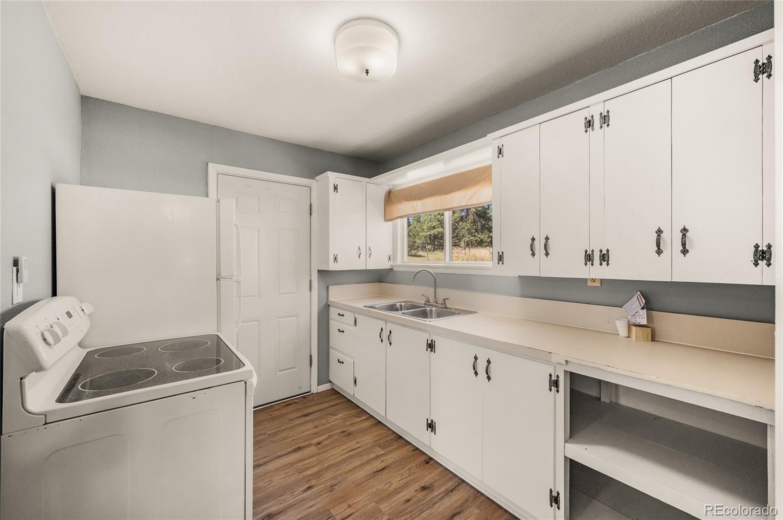 2925 M Path Cotopaxi, CO 81223 - Photo 23 of 50 a kitchen with a sink a stove and cabinets