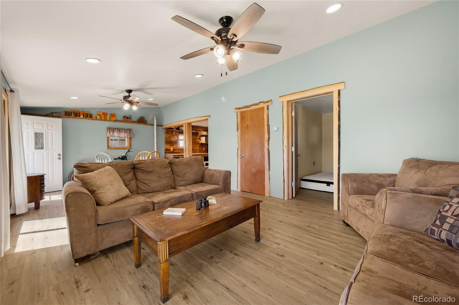 2925 M Path Cotopaxi, CO 81223 - Photo 7 of 50 a living room with furniture and a chandelier