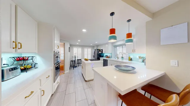 a view of kitchen island with furniture and tv