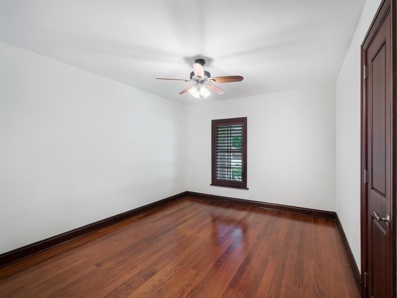 441 Ridge Road Coral Gables, FL 33143 - Photo 15 of 23 wooden floor in an empty room with a window