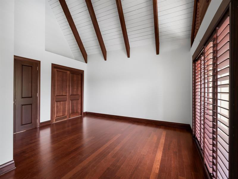 441 Ridge Road Coral Gables, FL 33143 - Photo 19 of 23 a view of an empty room with wooden floor and stairs