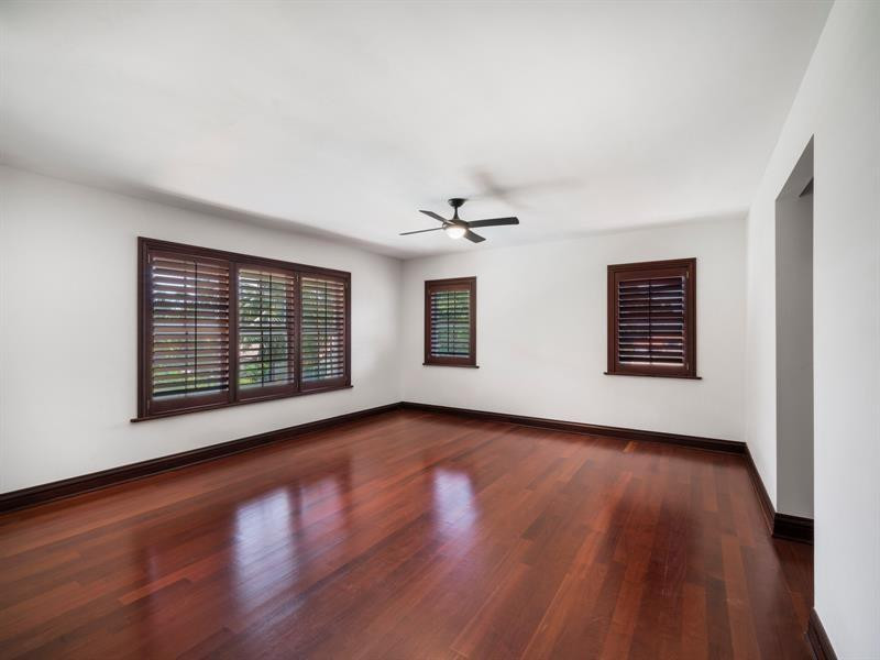 441 Ridge Road Coral Gables, FL 33143 - Photo 20 of 23 a view of an empty room with wooden floor and windows