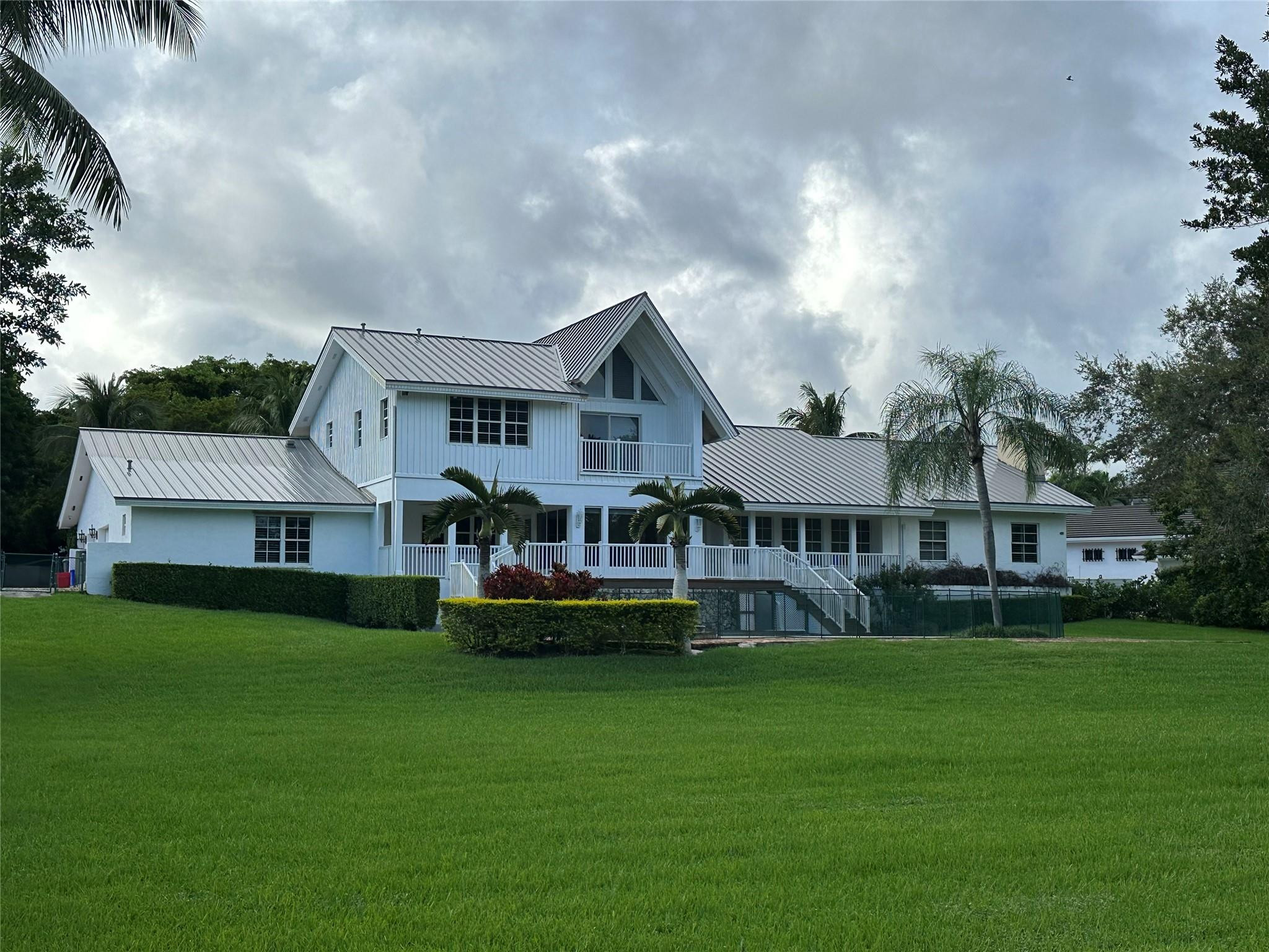 441 Ridge Road Coral Gables, FL 33143 - Photo 3 of 23 a front view of house with yard and green space
