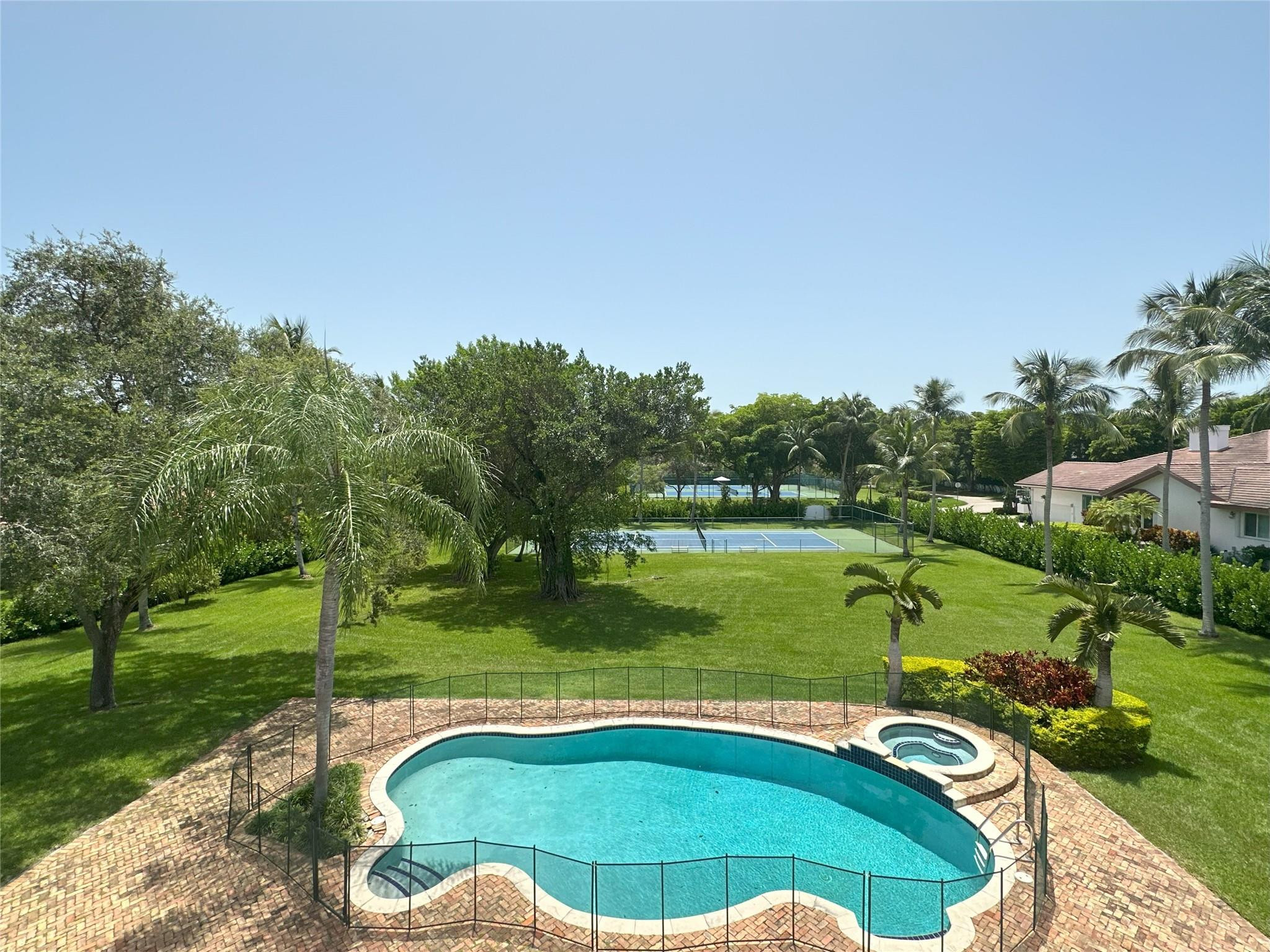 441 Ridge Road Coral Gables, FL 33143 - Photo 5 of 23 a view of a golf course with a swimming pool