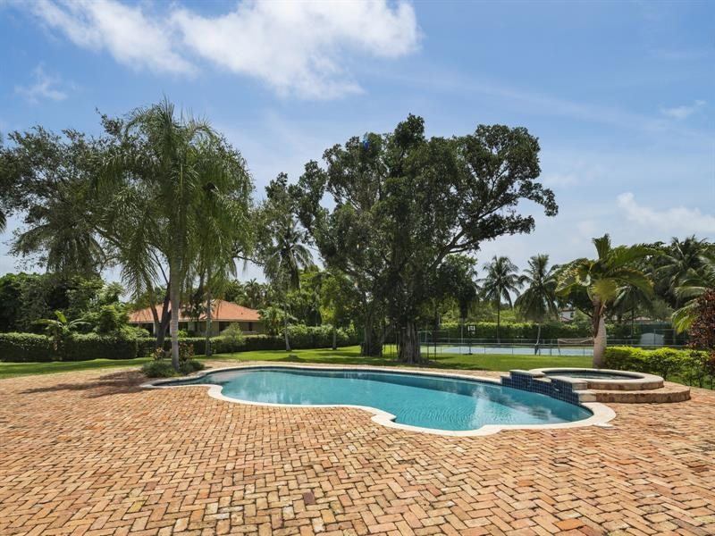 441 Ridge Road Coral Gables, FL 33143 - Photo 6 of 23 a view of a swimming pool with a yard