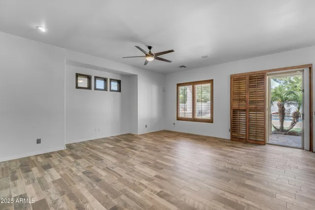 a kitchen with sink a microwave and cabinets