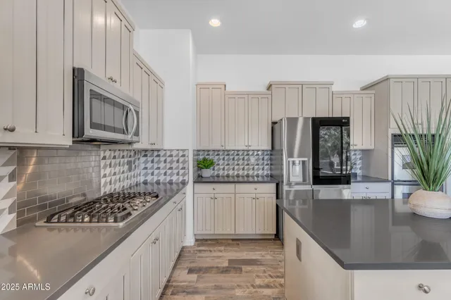 a view of a bathroom with a shower and a sink