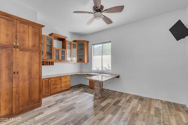 a bathroom with a granite countertop sink mirror and a bathtub