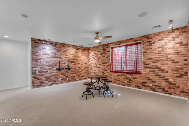 a front view of a house with a yard patio and fire pit