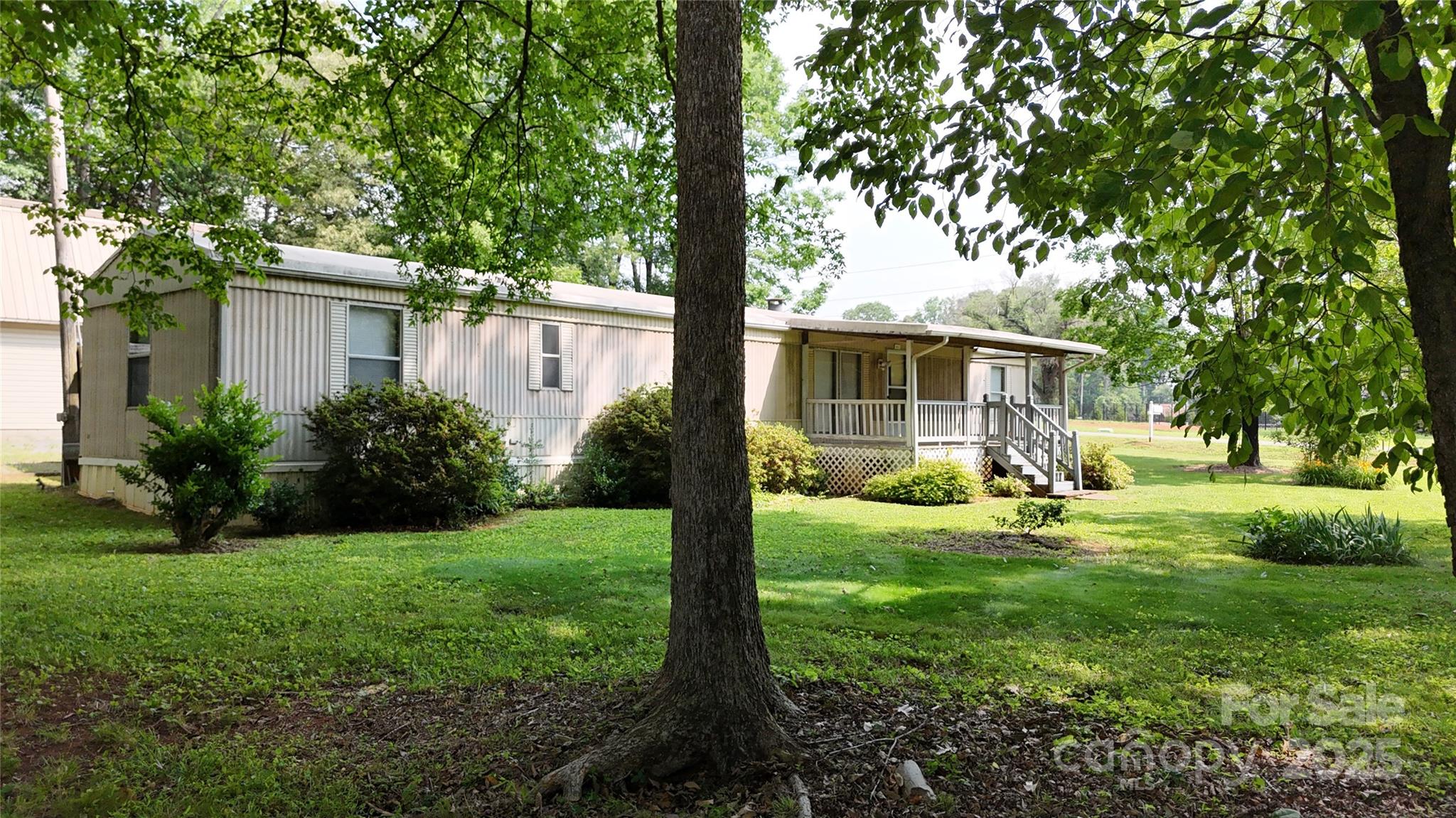 8112 Blackwood Road Denver, NC 28037 - Photo 2 of 19 a view of a house with backyard and sitting area