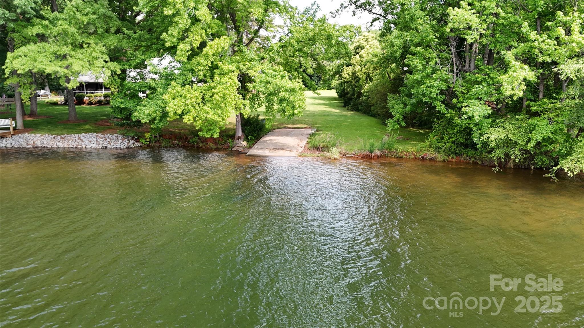 8112 Blackwood Road Denver, NC 28037 - Photo 8 of 19 a view of a lake with a yard