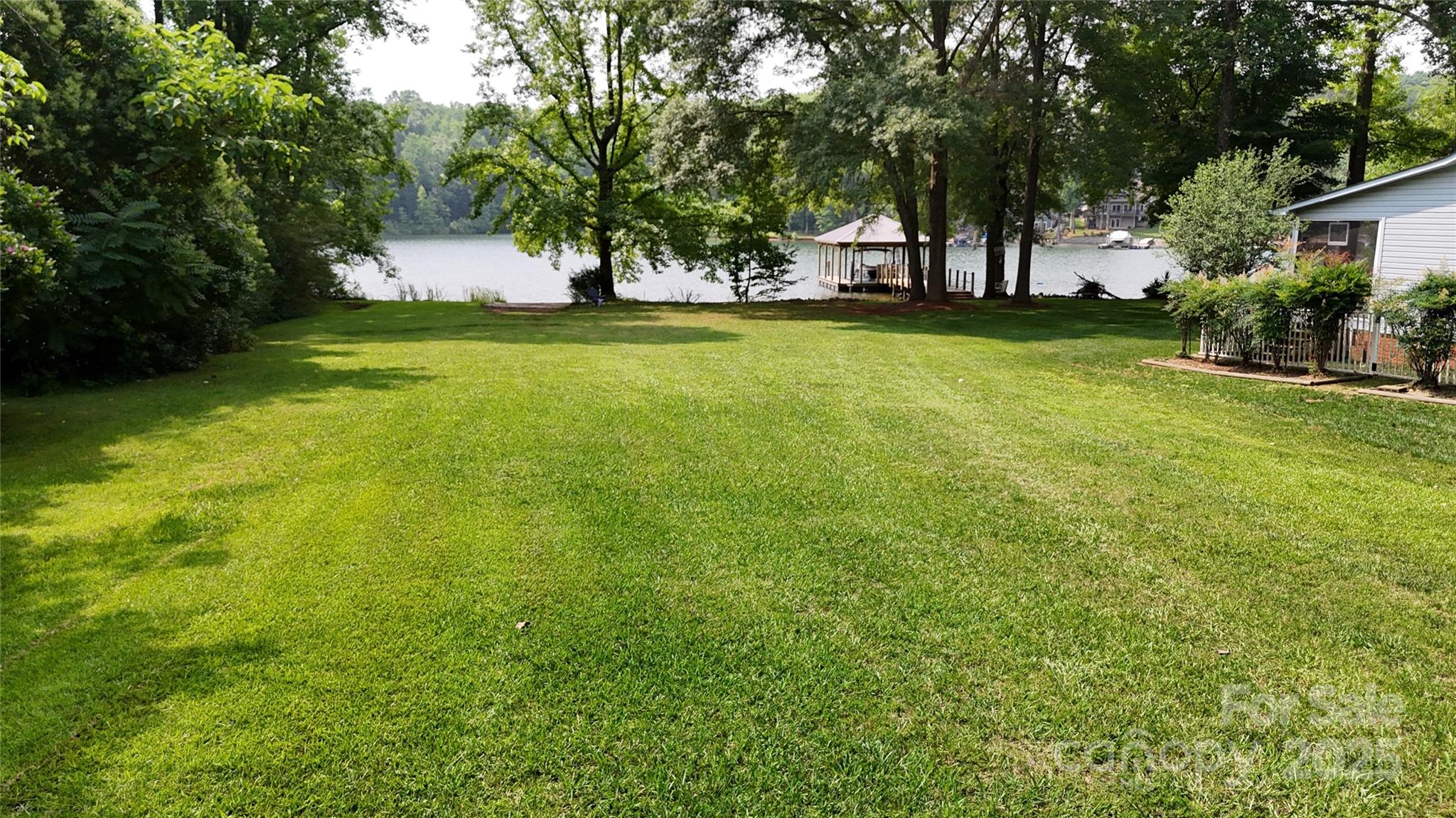 8112 Blackwood Road Denver, NC 28037 - Photo 9 of 19 a view of a yard with a large trees