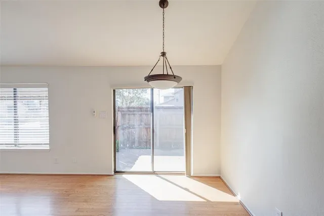 a kitchen with stainless steel appliances a stove refrigerator and microwave