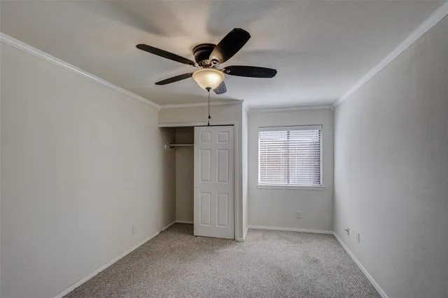 a view of a house with a wooden fence