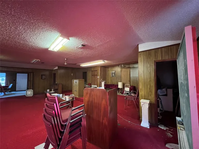 a living room with furniture a dining table and chairs