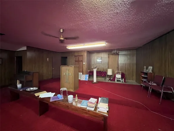 a living room with furniture a dining table and wooden floor