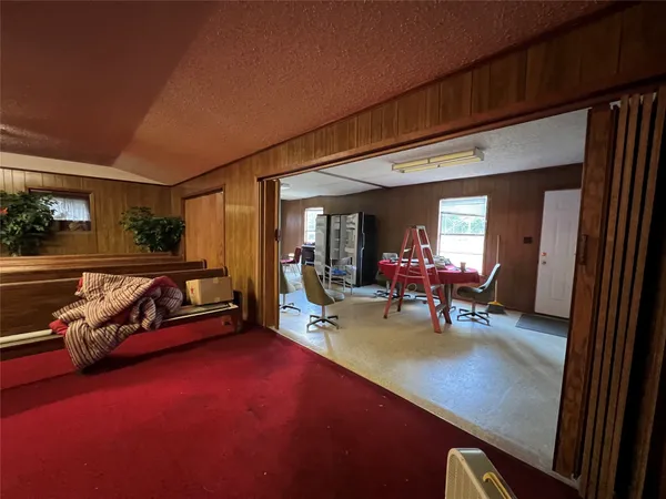 a view of a livingroom with furniture and a fireplace