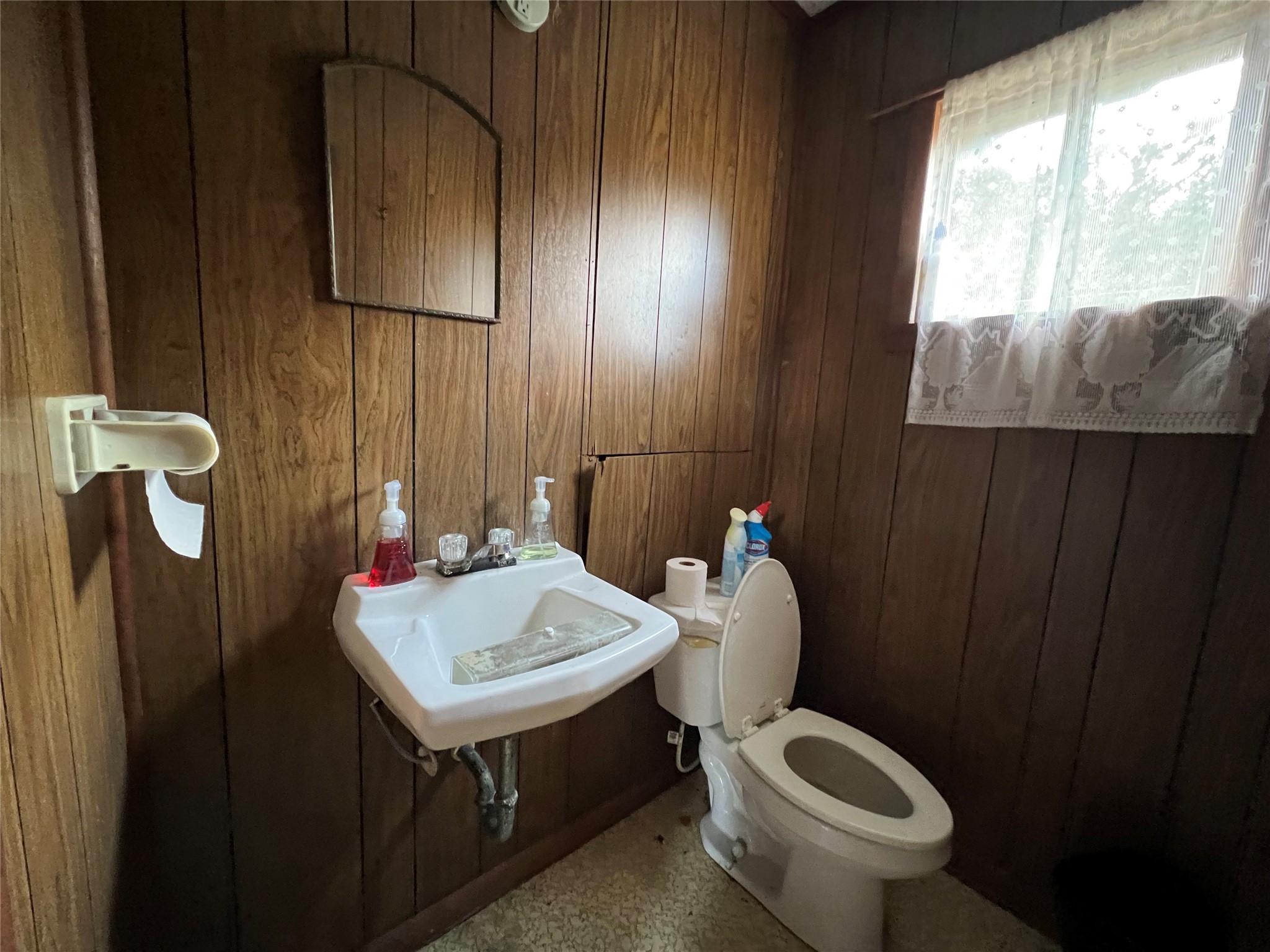 Tbd Filmore Street Trinity, TX 75862 - Photo 17 of 26 a bathroom with a toilet sink and mirror