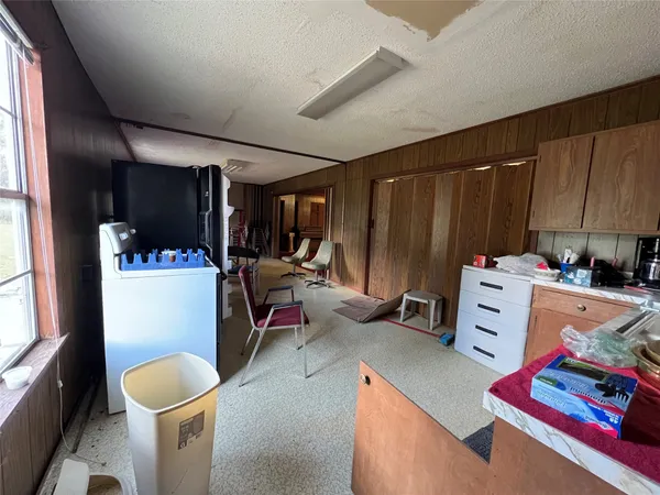 a kitchen with stainless steel appliances wooden cabinets sink and stove