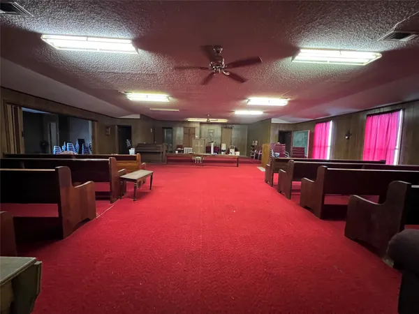 a room with lots of furniture and a flat screen tv