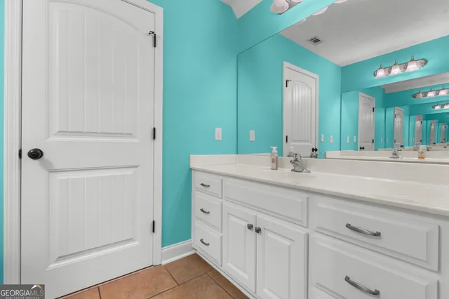 a white toilet sitting next to a bath tub